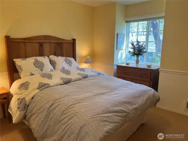 The bedroom is warm and cozy.