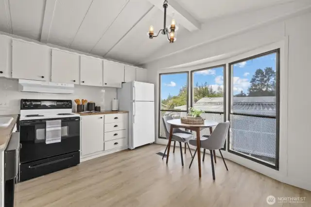 Open concept living room to kitchen offering tons of natural light.
