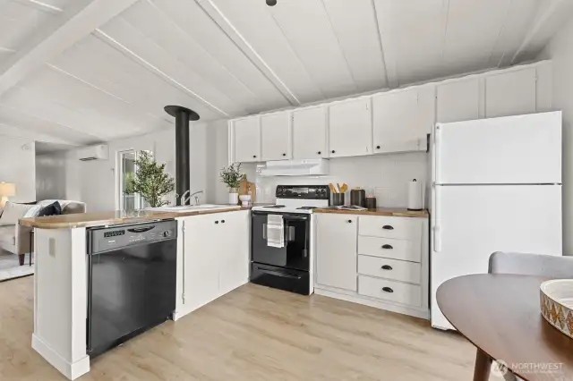 Open concept living room to kitchen offering tons of natural light.