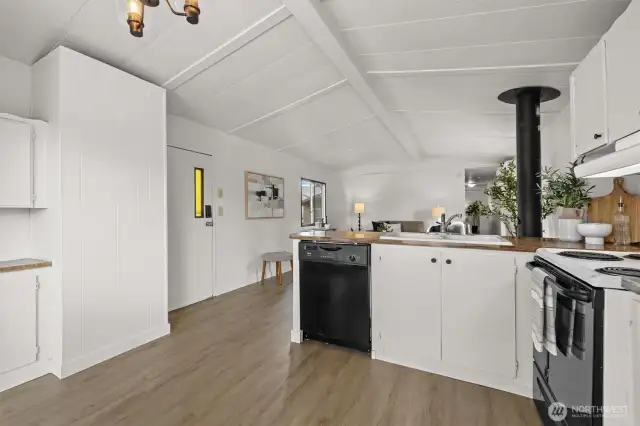 Open concept living room to kitchen offering tons of natural light.