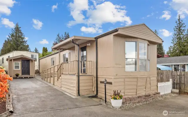 Front of home and storage shed. Home tucked away towards the back of the park at the end of the street.