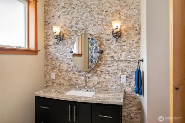 Guest Bathroom has a beautiful rock feature wall