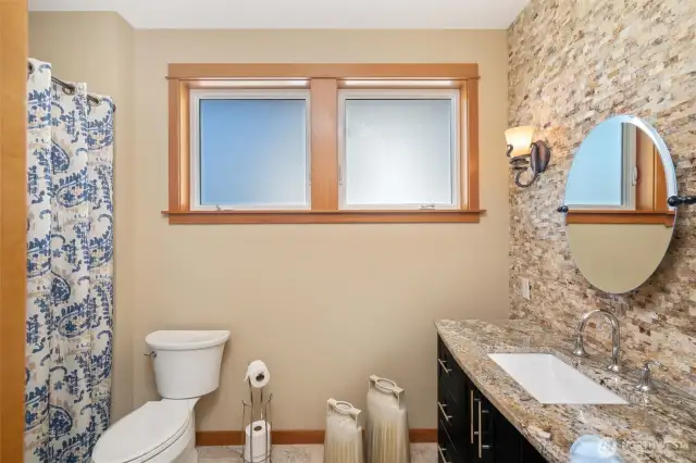 Guest Bathroom has a beautiful rock feature wall
