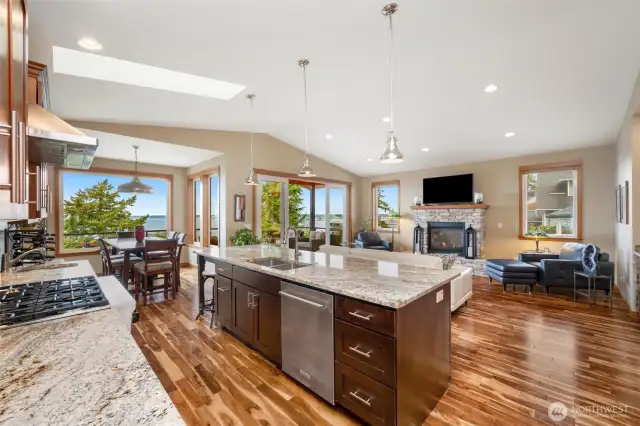 Entertainers Delight kitchen with cherry cabinetry, 2 skylights, 5 burner gas stove, granite countertops and Stainless appliances.