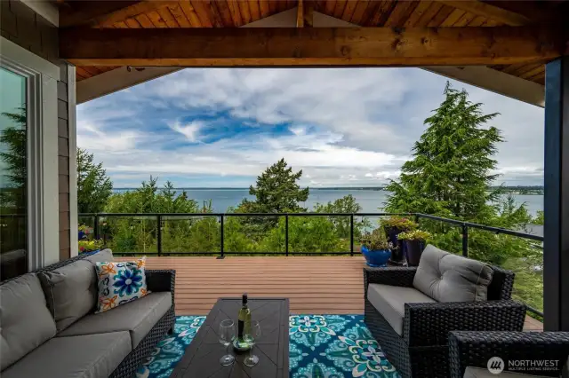 Covered Deck Space offers built in heaters and a natural gas hookup for your grill.  Constructed out of composite wood decking and surrounded by a glass metal framed rail.