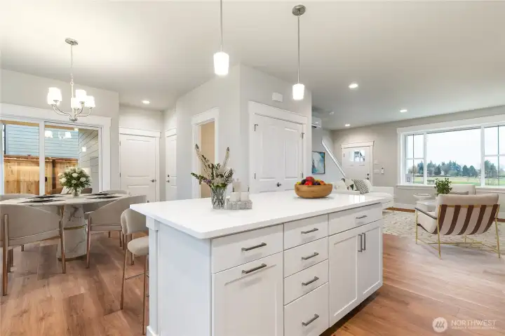 Staged kitchen and dining- digitally staged for sample purposes only.