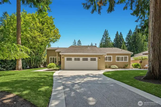 Expansive driveway leads to the front entry