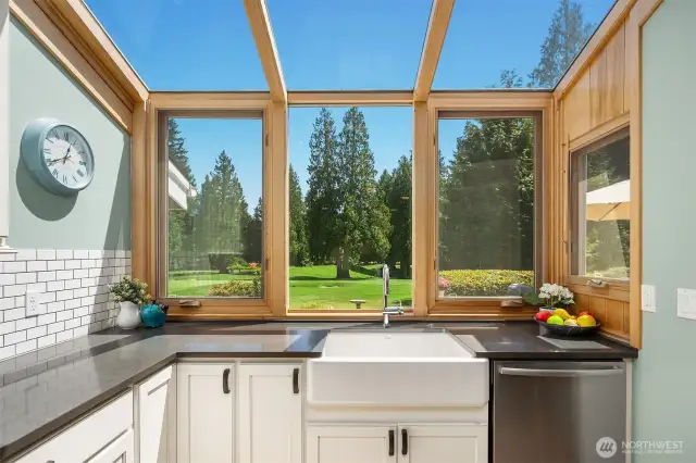 Golf course backdrop elevates the kitchen experience