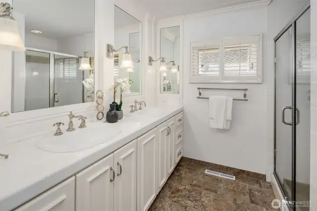 Beautifully appointed primary bath with timeless style