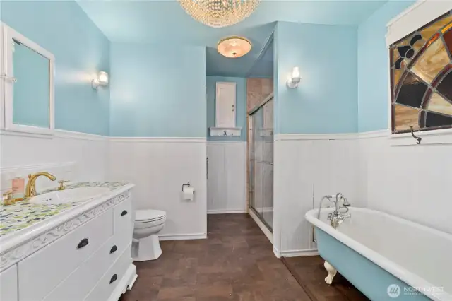 Spacious Full Bathroom on Main, Featuring a Clawfoot Tub & Separate Shower