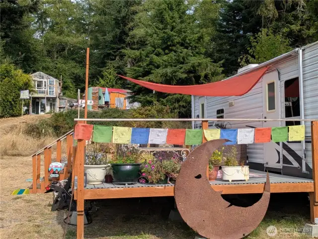 RV with deck.  The deck is made in a way to easily deconstruct and be used however.