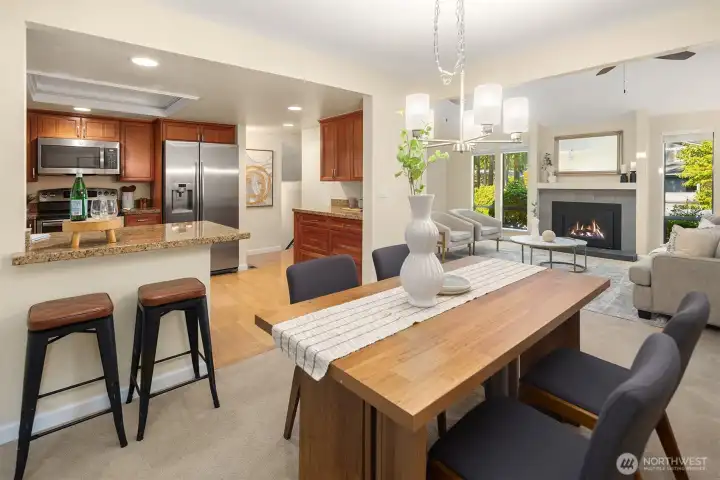 Dining area just off the kitchen featuring granite counters, stainless steel appliances, and plenty of cabinet space.