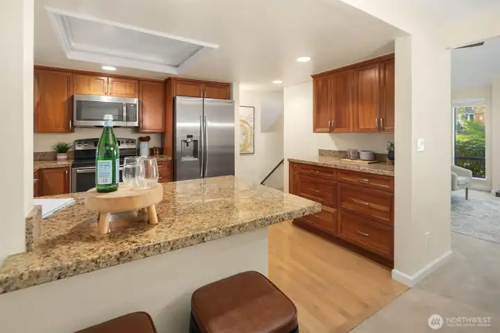 Kitchen featuring granite counters, stainless steel appliances, and plenty of cabinet space.