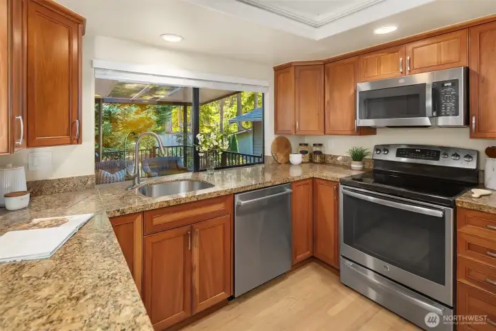 Kitchen featuring granite counters, stainless steel appliances, and plenty of cabinet space.