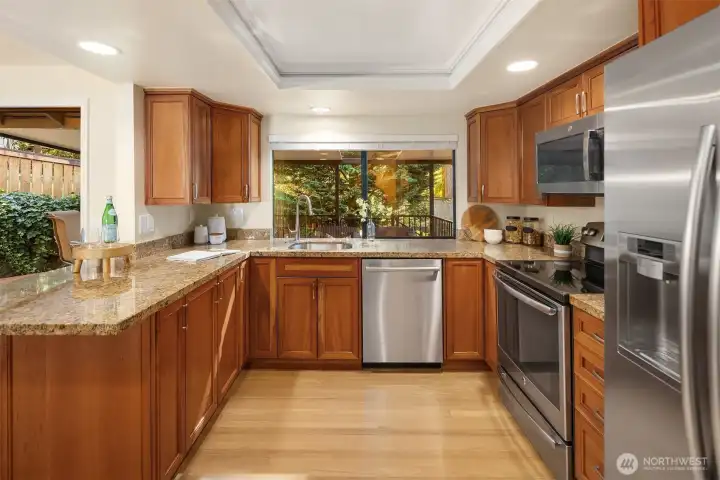 Kitchen featuring granite counters, stainless steel appliances, and plenty of cabinet space.