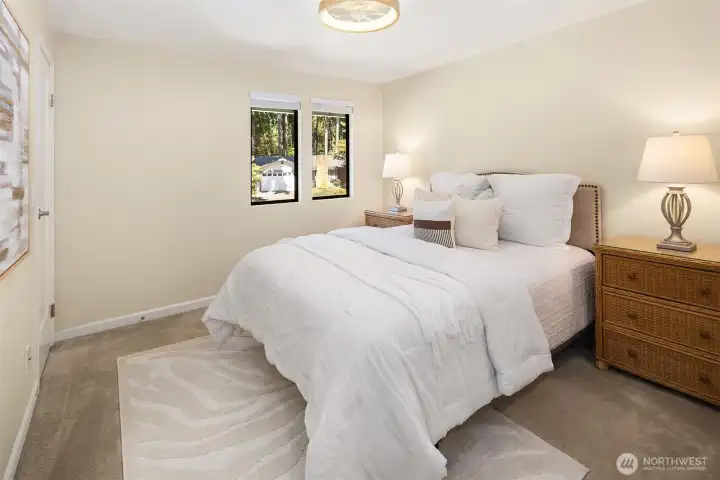Bedroom 1 with remote operated low profile ceiling fan with light & walk-in closet.