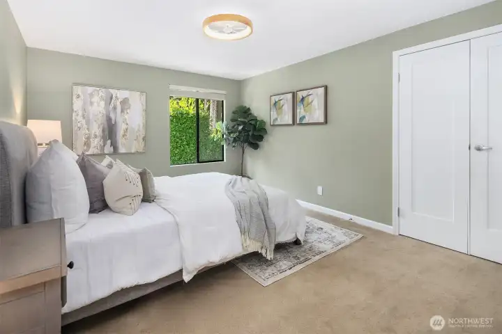 Master bedroom with remote operated low profile ceiling fan with light, French doors, large closet, and attached 3/4 bath.