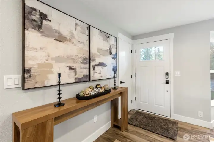 Welcoming entryway with modern finishes, and durable flooring—setting the tone for the home’s contemporary design.