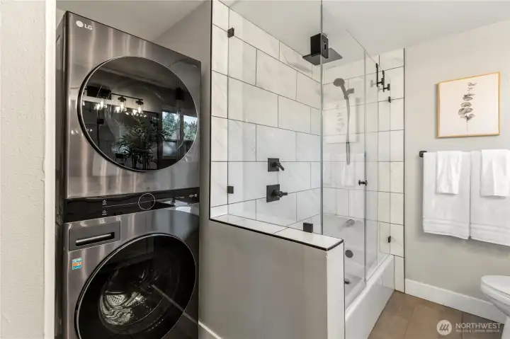 Convenient in-home laundry with modern stacked washer and dryer.