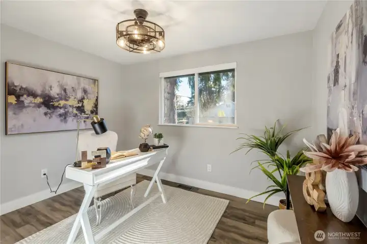 This bright and airy room features a spacious layout, perfect for a home office. This room also includes built in shelving in the closet.