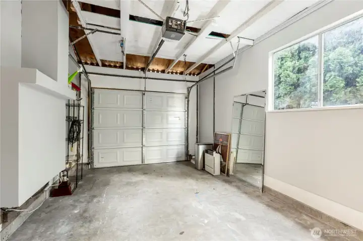 Spacious one-car garage with natural light and room for storage or a workshop.