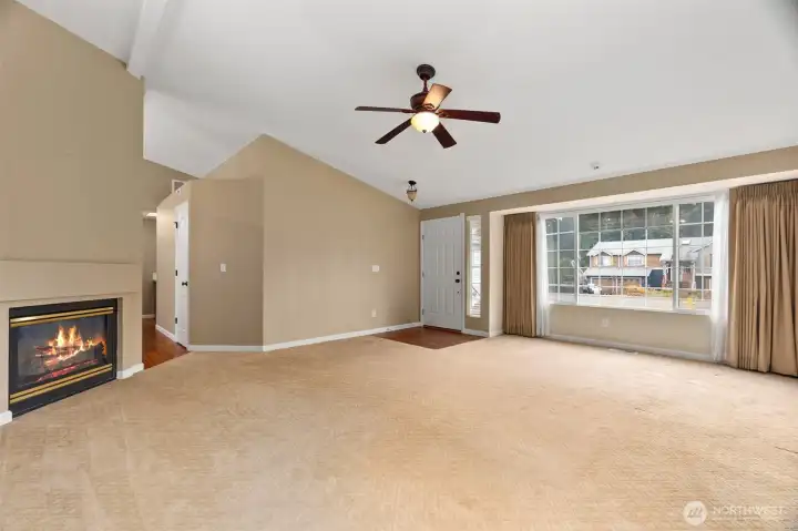 Light and bright living room with gas fireplace.
