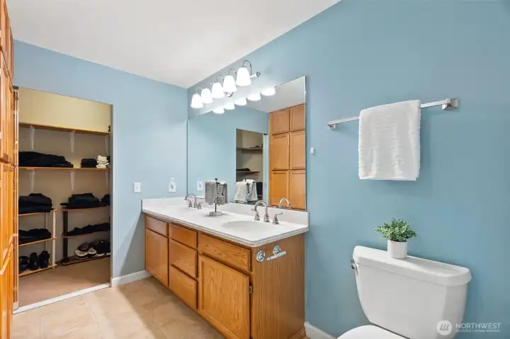 Primary bathroom with two walk-in closets