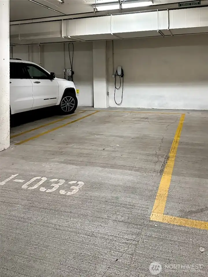 Two prime parking spaces - one with EV charger and outlet