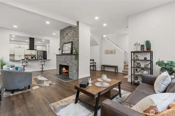 Enter the Main Floor off N 9th into the Living Room w/Floor to Ceiling Stacked Stone Wood-Burning Fireplace is Open to the Kitchen. New Laminate Floors!