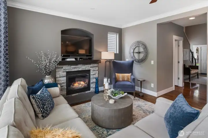 Gas fireplace in the living room.  Crown molding.