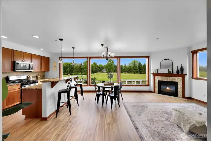 Living area with a wall of windows to enjoy the views of outside. The gas corner fireplace just makes it all a little cozier . Living area with a wall of windows to enjoy the views of outside. The gas corner fireplace just makes it all a little cozier .