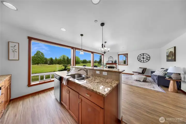 Granite counters, great work space and cabinets, great views looking towards living area. Granite counters, great work space and cabinets, great views looking towards living area.