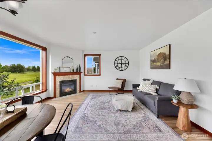 Living room with cozy corner fireplace. Living room with cozy corner fireplace.
