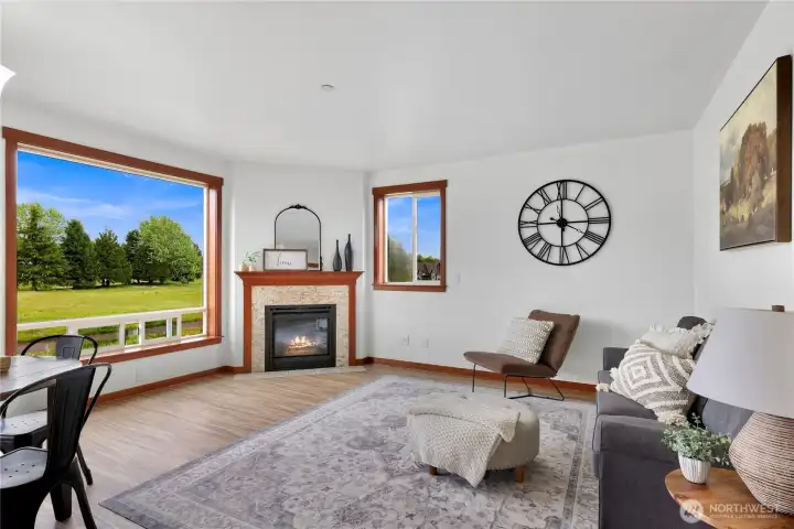 Living room with cozy corner fireplace. Living room with cozy corner fireplace.