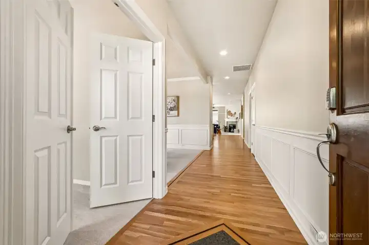 Entry hallways with second bedroom off to left of frame through French Doors. Currently staged as a music room and office. Entry hallways with second bedroom off to left of frame through French Doors. Currently staged as a music room and office.