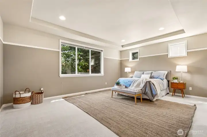 The primary bedroom offers a serene, light-filled retreat designed for comfort and privacy. Its generous proportions allow for multiple furniture layouts, creating a restful space that feels both spacious and inviting. Thoughtful single-level living continues here with direct access to the spa-inspired ensuite, making this suite a true sanctuary at the end of the day. Soft, new carpet underfoot! The primary bedroom offers a serene, light-filled retreat designed for comfort and privacy. Its generous proportions allow for multiple furniture layouts, creating a restful space that feels both spacious and inviting. Thoughtful single-level living continues here with direct access to the spa-inspired ensuite, making this suite a true sanctuary at the end of the day. Soft, new carpet underfoot!