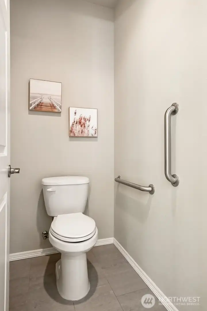 The Primary hosts a separate water closet with dual grab bars. The Primary hosts a separate water closet with dual grab bars.