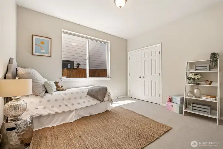 A comfortable third bedroom with soft new carpet and ample closet space. A comfortable third bedroom with soft new carpet and ample closet space.