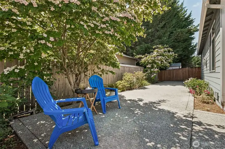 A large one-level patio offers easy outdoor living without the upkeep or the stairs. Its low-maintenance design means more time relaxing and less time spent on yard work, while the surrounding landscaping provides a beautiful, mature backdrop that feels private and serene. A large one-level patio offers easy outdoor living without the upkeep or the stairs. Its low-maintenance design means more time relaxing and less time spent on yard work, while the surrounding landscaping provides a beautiful, mature backdrop that feels private and serene.