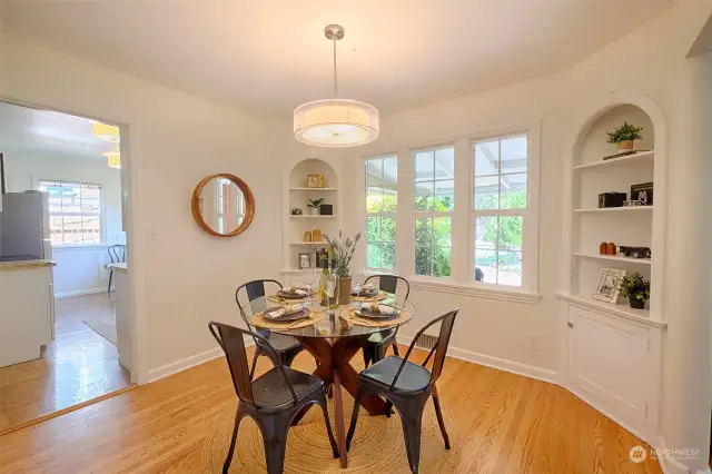 Formal dining room has lovely vintage built-ins and new lighting.