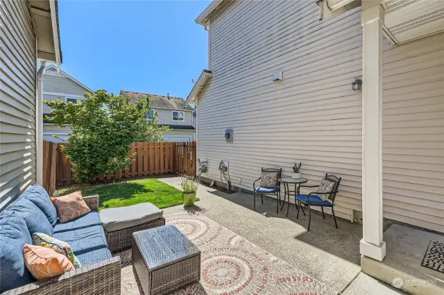 Outdoor Oasis: Fully fenced backyard with an oversized patio, perfect for entertaining