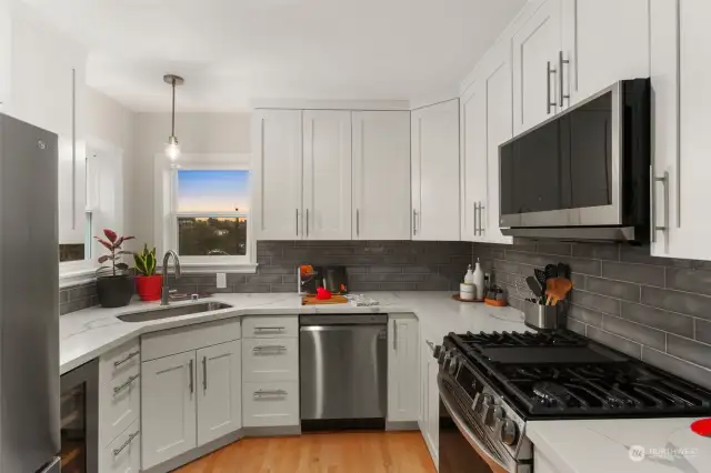 New quartz countertops, soft-close cabinets, all new appliances! Gas Range and Wine fridge!