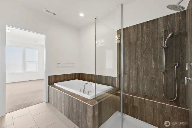 .A luxurious primary bath really adds to the experience of this home. A perfect place to unwind.