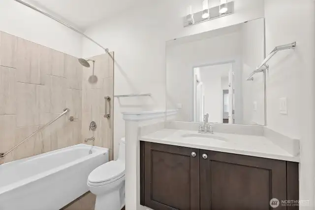 The main guest bath is thoughtfully designed to offer both style and comfort.