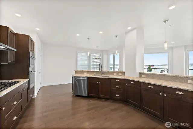 Gorgeous and spacious kitchen with storage galore.  Pull-outs in the drawers. 5-burner gas stove. Pantry closet. Beautiful appliances.