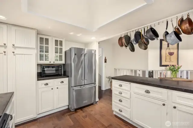 Note the spacious reach-in pantry soon the left side of the photo