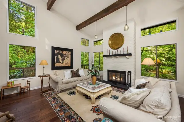 The wood-burning fireplace anchors the spacious living room
