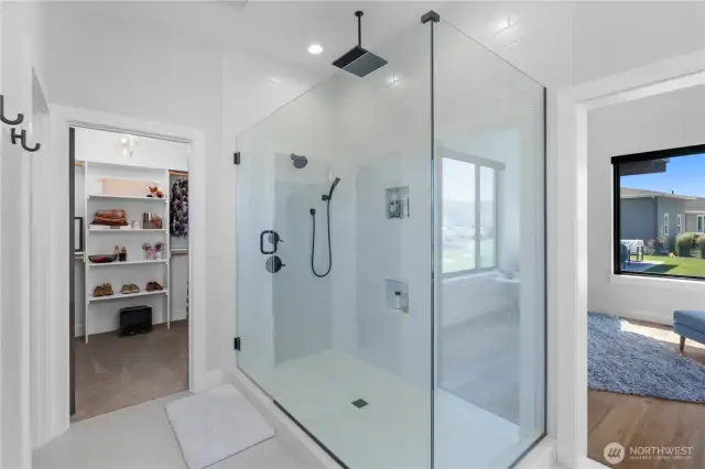 Primary shower featuring waterfall shower head.