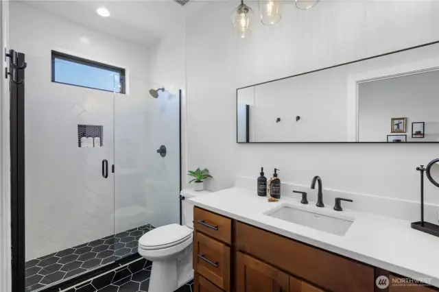 Ensuite bathroom for bedroom 2 with walk in tile shower.