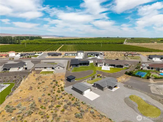 Aerial view of home facing the orchards.